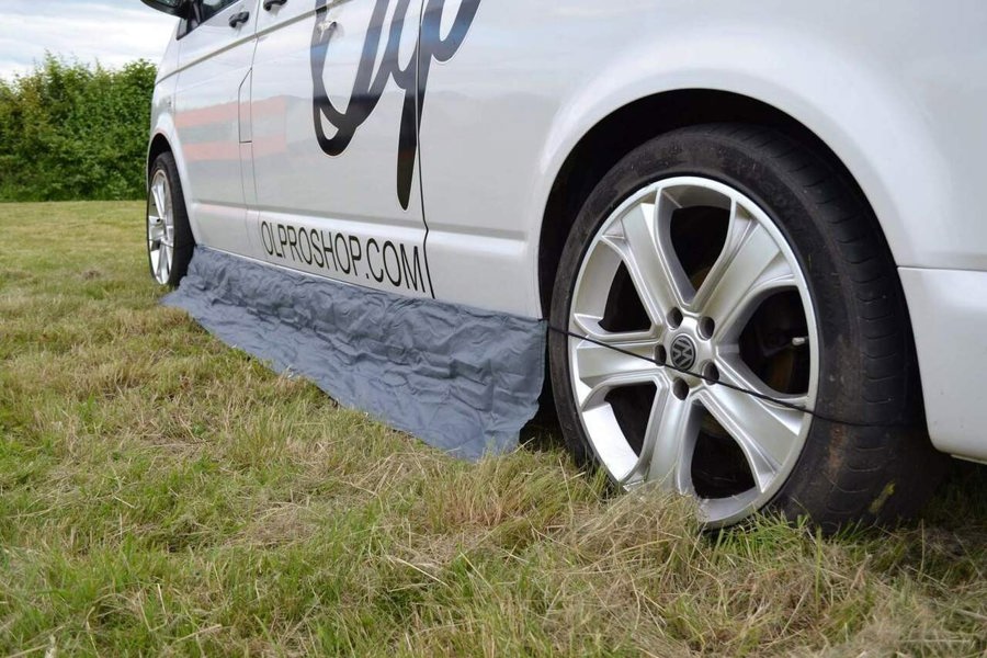 An image of the Awning Skirt and Draught Excluder Size Small from OLPRO attached to a VW Campervan.