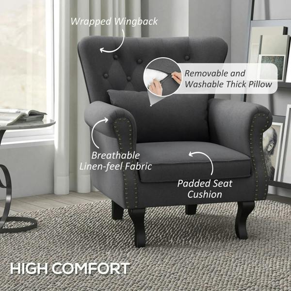 Dark grey Chesterfield-style accent chair with padded seat and nailhead-trim arms