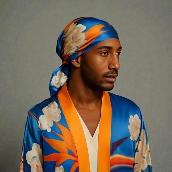 Silk scarf featuring an Orange Bird of Paradise with a White and Blue Cherry Blossom print, displayed as a headscarf to showcase its vibrant design.