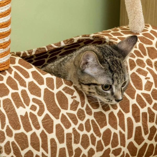 Beige giraffe-pattern cat tunnel bed with a gray tabby sleeping inside