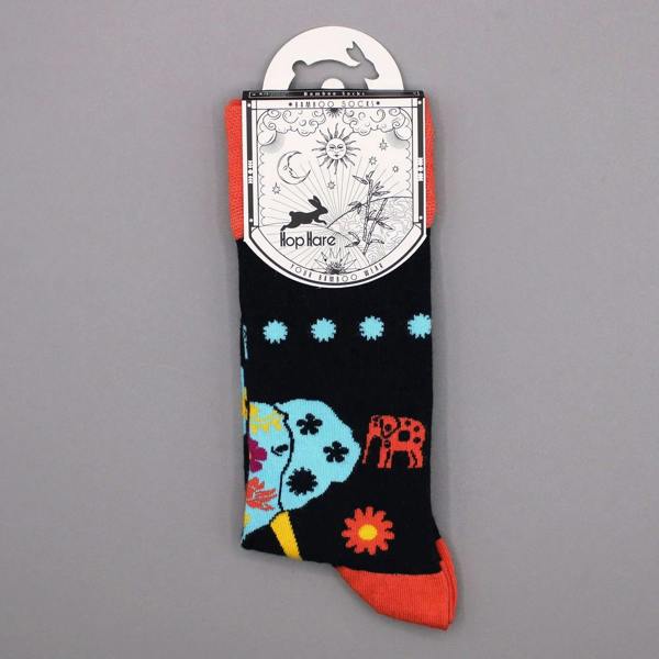 Single kids bamboo sock on tag, black with blue elephant and flower pattern, orange toe