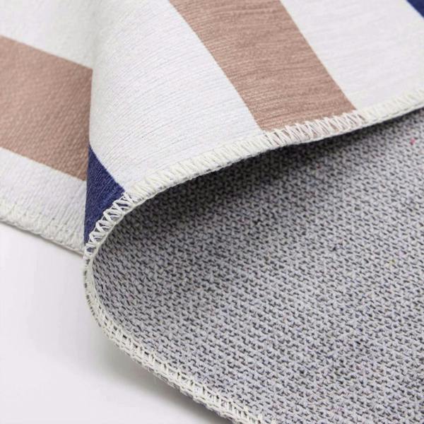 Close-up of a striped fabric with brown, white, and blue colors on a white background.