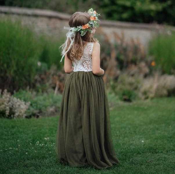 Girl standing in a park wearing a Bohemian Classic Dress in Olive Green