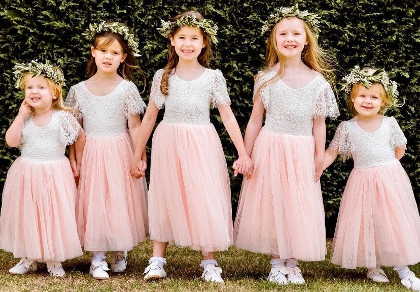 Young children wearing same pretty dress