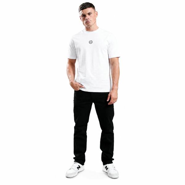 Marshall Artist black overdye denim jeans in a regular fit, styled with a white t-shirt and sneakers.