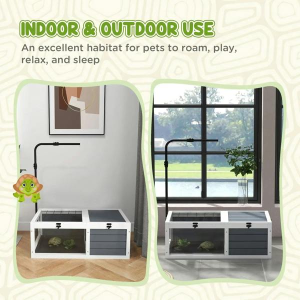Tortoise habitat table with lamp pole, wire top, and grey storage drawers.