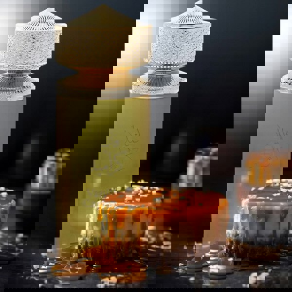 Ajyad Vanilla Caramel 100ml EDP bottle in golden spotlight