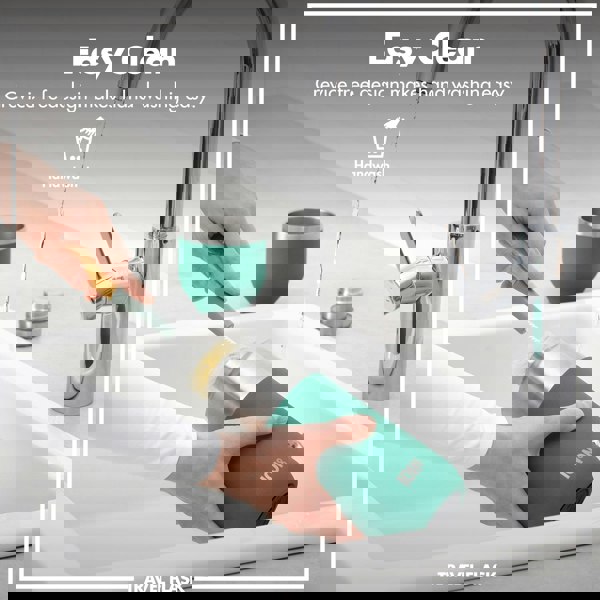 Hands holding a travel flask being cleaned with a brush under a running faucet in a kitchen sink Easy Clean Crevice free design makes hand washing easy Handwash Travel Flask