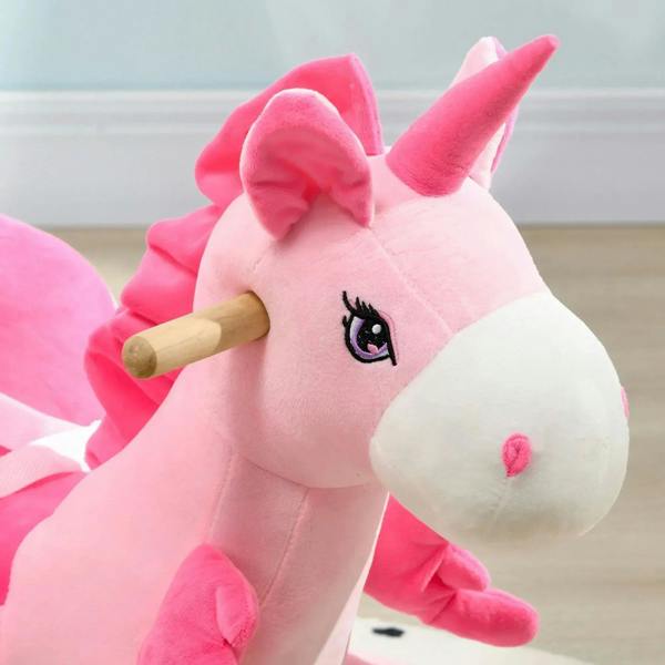 Pink and white plush unicorn rocking horse with wooden handle and embroidered face