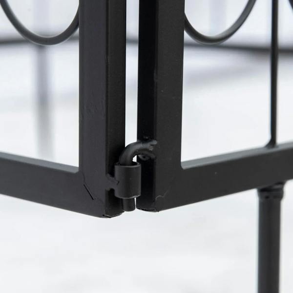 Black metal fence stake lock and base connector, close-up detail