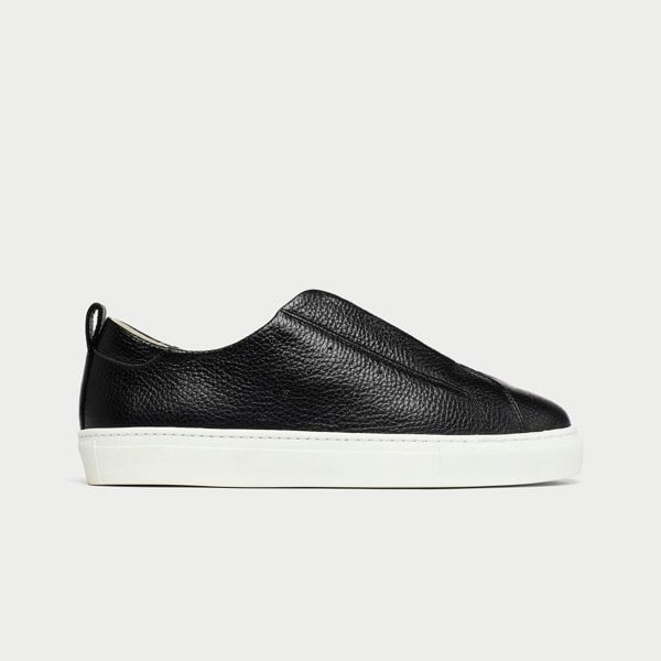 Black leather slip-on sneaker on a light gray background