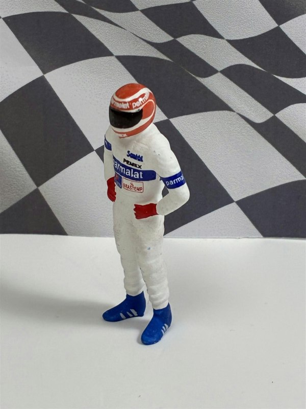 a toy figure of a man wearing a helmet
