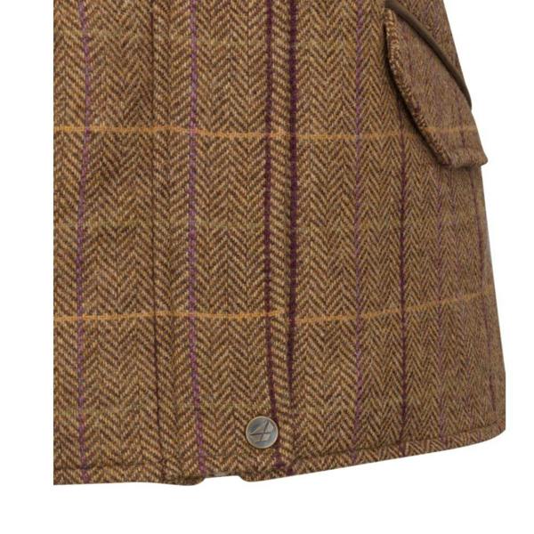 Close-up of the Hoggs of Fife Eden Technical Tweed Gilet showing herringbone wool tweed fabric, check pattern, and antique brass stud detail