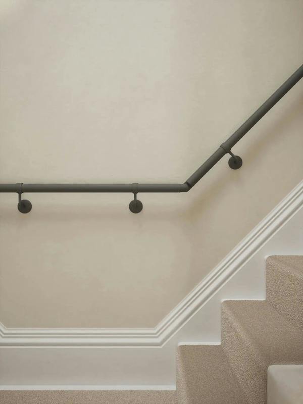 Luddington textured grey t shape handrail showing brackets and elbows with a rise.