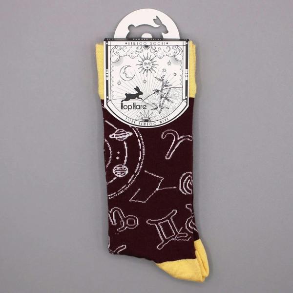 Burgundy crew bamboo socks with zodiac icons and mustard toe cuff.