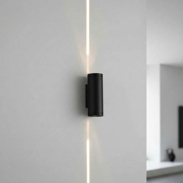 black up and down outside light mounted on a white wall on the exterior of a house