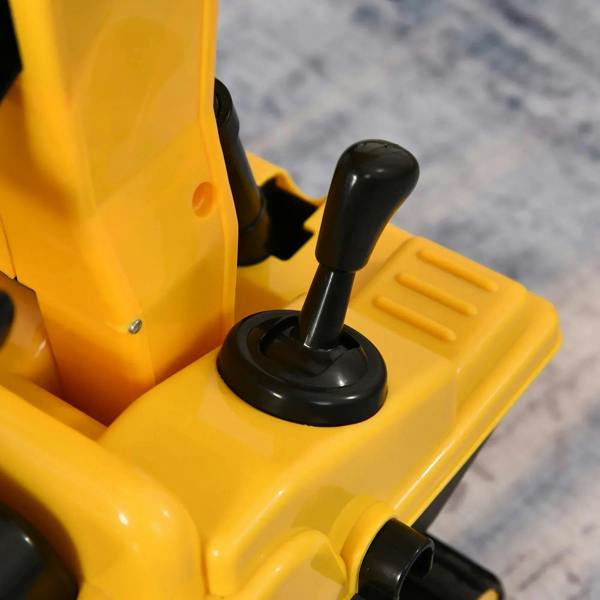 Yellow ride-on excavator toy interior with black gear lever and dashboard controls