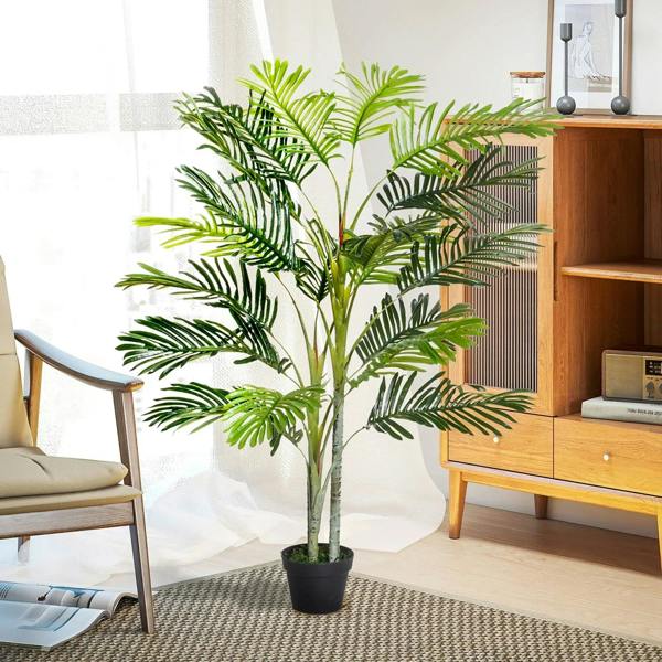 Artificial topiary tree with dark green fronds on slender stems in a dark pot