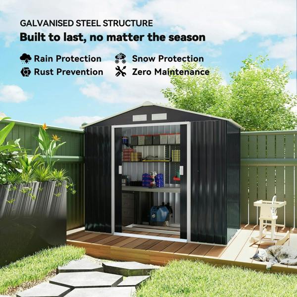Dark grey metal storage shed with open interior racks, ventilation openings on the roof.