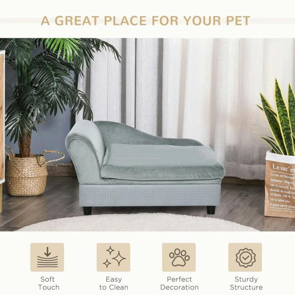 Light grey pet sofa chair with cushion beside plants and curtains