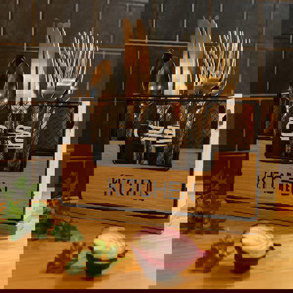 Wooden kitchen utensil holder with cutlery on a wooden surface with a tiled wall background.