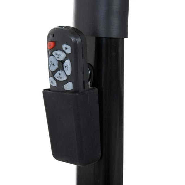 Black handheld remote control mounted on the treadmill handlebar with button pad.