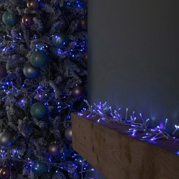 Samuel Alexander 12.4m 960 LED Christmas Cluster Multi-Action String Lights with Timer in Blue, Purple & White on Clear Cable