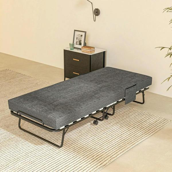 Single folding bed with dark grey mattress, black metal frame, and caster wheels for mobility