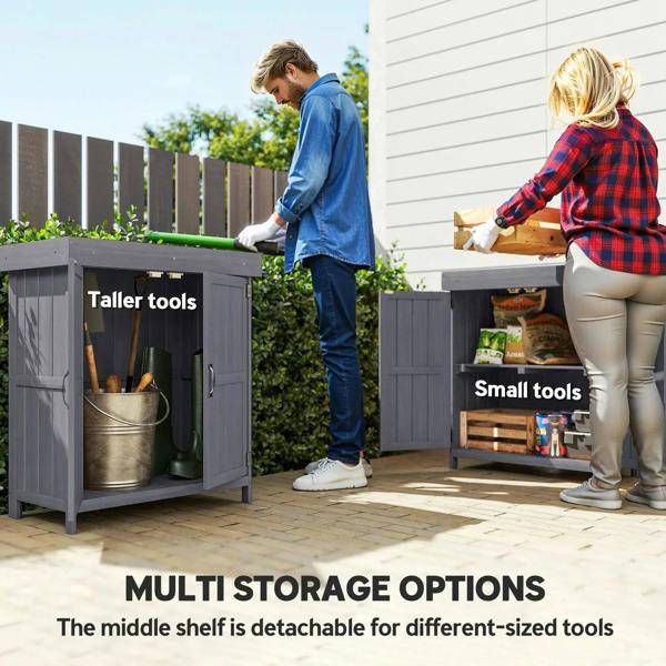 Dark gray wooden shed with open doors and detachable middle shelf for tools