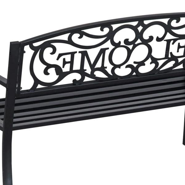 Black steel bench back panel close-up with ornamental scrollwork and cutout
