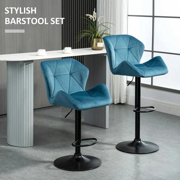 Blue velvet bar stool set of 2 with black round bases and footrests, angled view