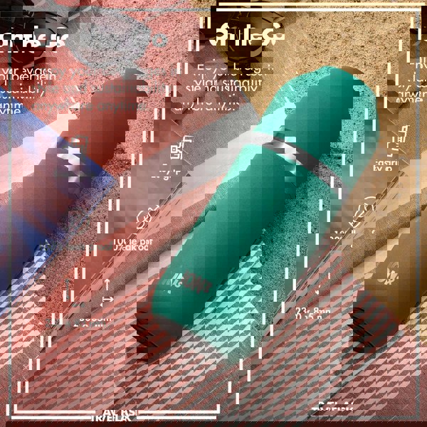 A green travel flask lies on a striped beach towel in the sand surrounded by sunglasses and a magazine. Text reads On the Go Enjoy your beverages in style and sustainability anywhere anytime Easy grip 100% leak proof 230 x 85 mm ION8 TRAVEL FLASK