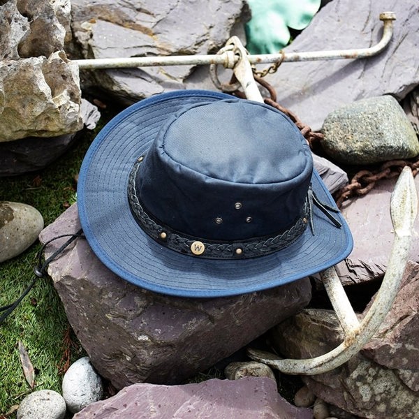 The wilderness navy waxed cotton unisex hat by Wombat