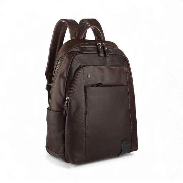 Brown leather backpack on a white background