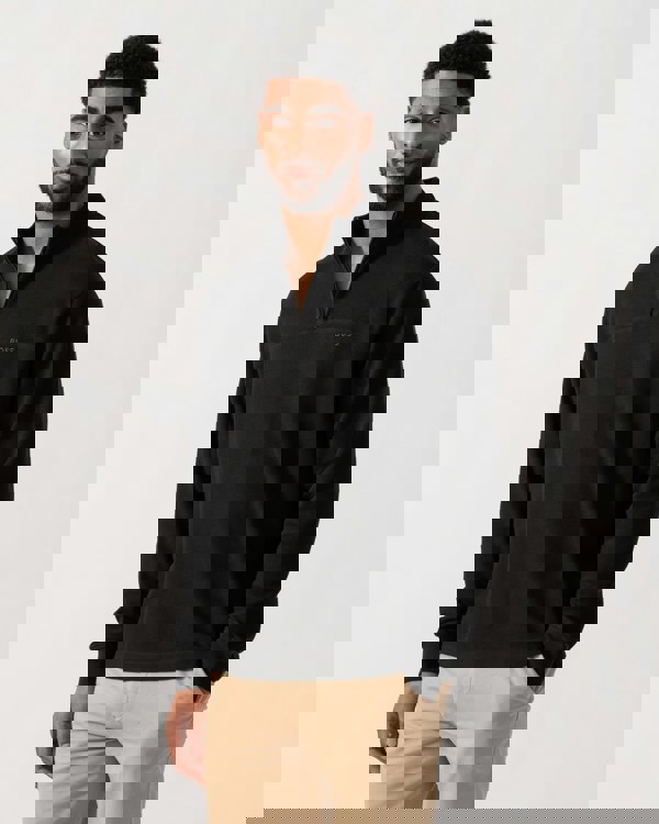 Model wearing BOSS Orange Hive Mens 1/4 Zip Sweatshirt in Black 001 - Main