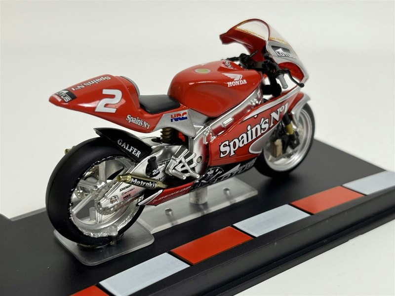 a red motorcycle on a stand