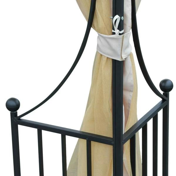 Beige sheer curtain corner panel on black metal gazebo frame with tie detail