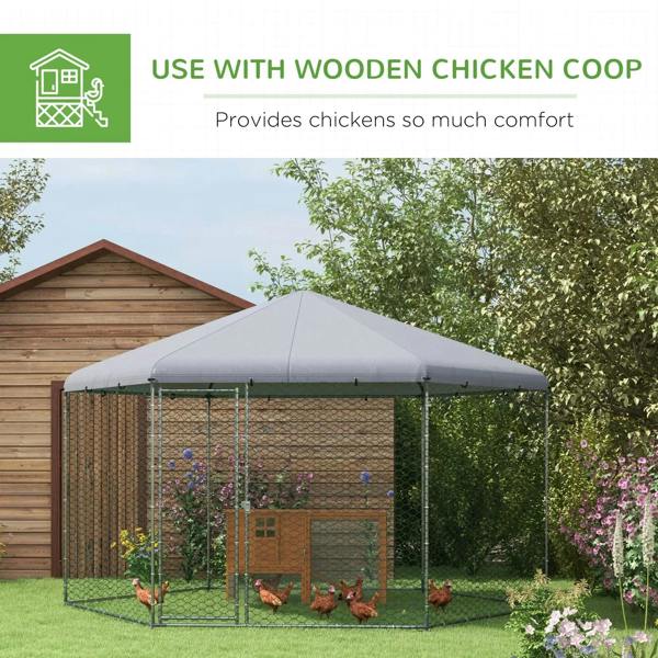 Outdoor chicken coop run with grey fabric roof, chain-link mesh panels, and hens