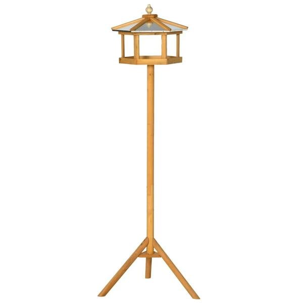 Wooden bird feeding table on tall stand, hexagonal roof, natural wood finish.