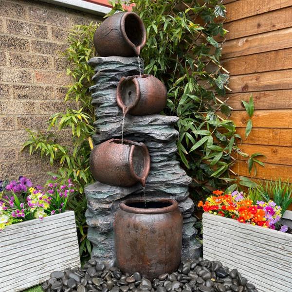 4 Pouring Jugs on Rock Traditional Water Feature
