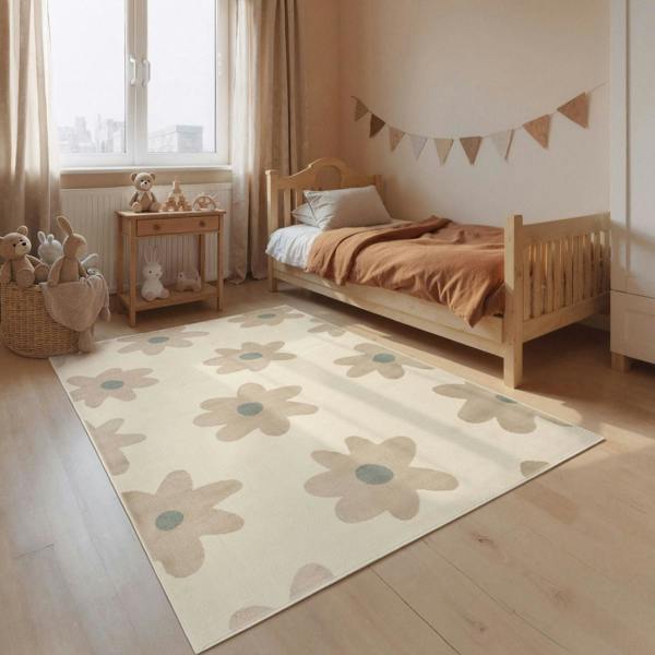 Children's bedroom with a floral rug, wooden bed, and toys.