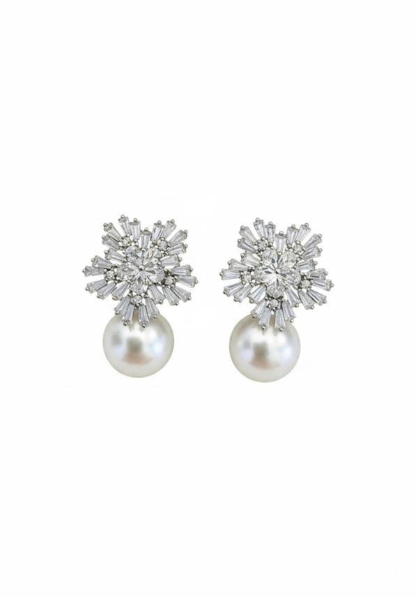 Rhodium plated starburst flower and pearl earrings with cubic zirconia.