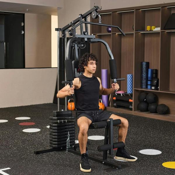 Black multifunction home gym machine with seated lat pulldown setup and weight stack