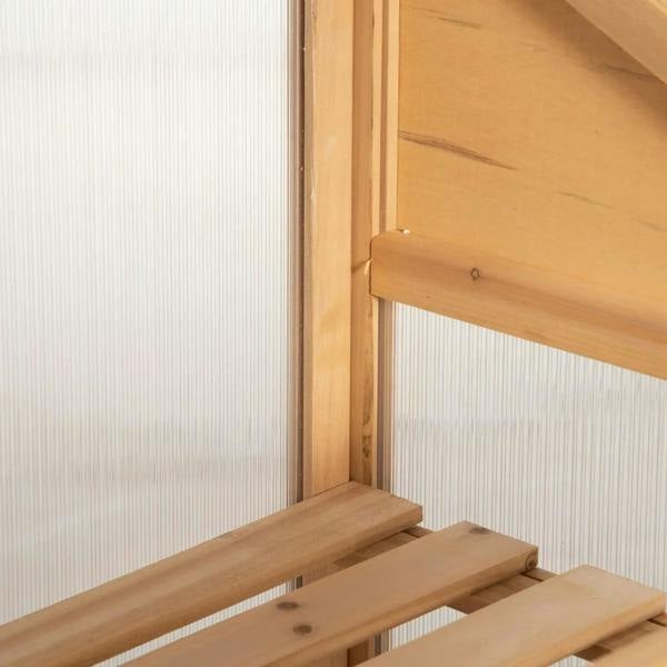 Close-up of wooden interior frame supports inside a cold frame greenhouse