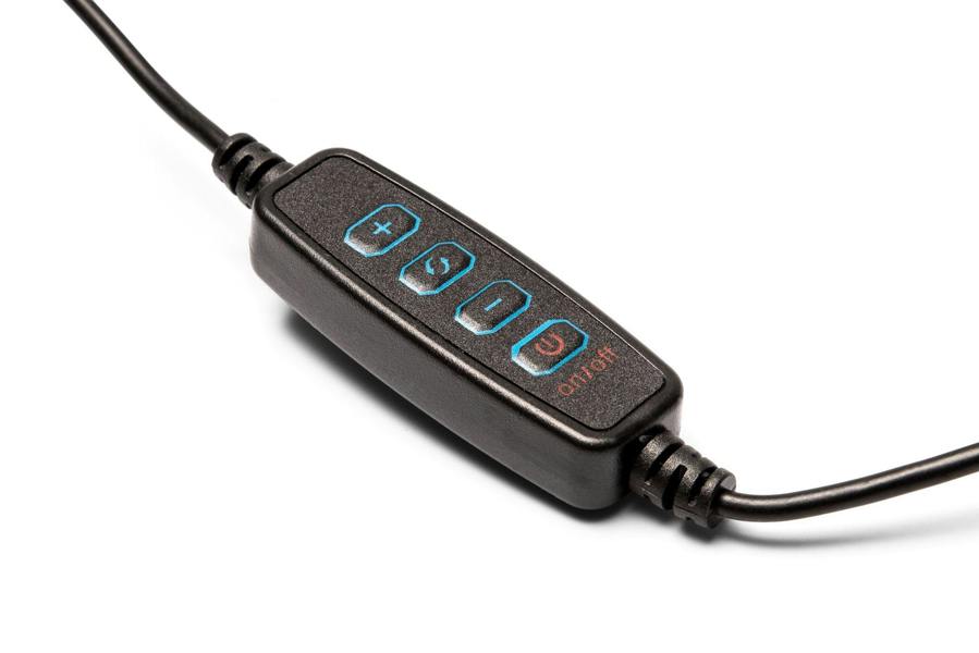 A close-up of Rios Makeup Perfector LED Ring Light black inline remote with four buttons—plus, minus, a circular arrow, and a red power symbol—attached to cables, designed for flawless makeup in any light against a white background.