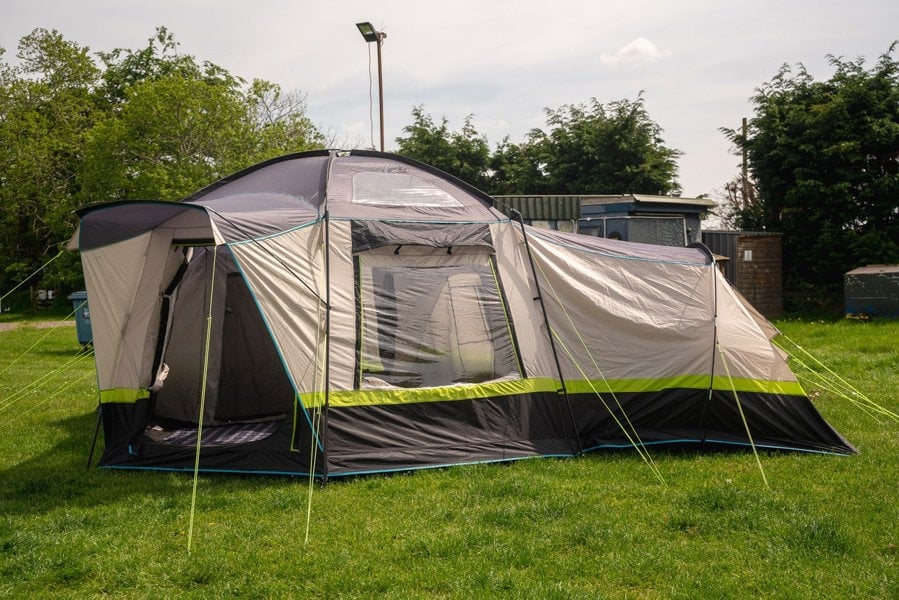 The Hive 6 Berth Poled Tent by OLPRO pitched in a campsite.