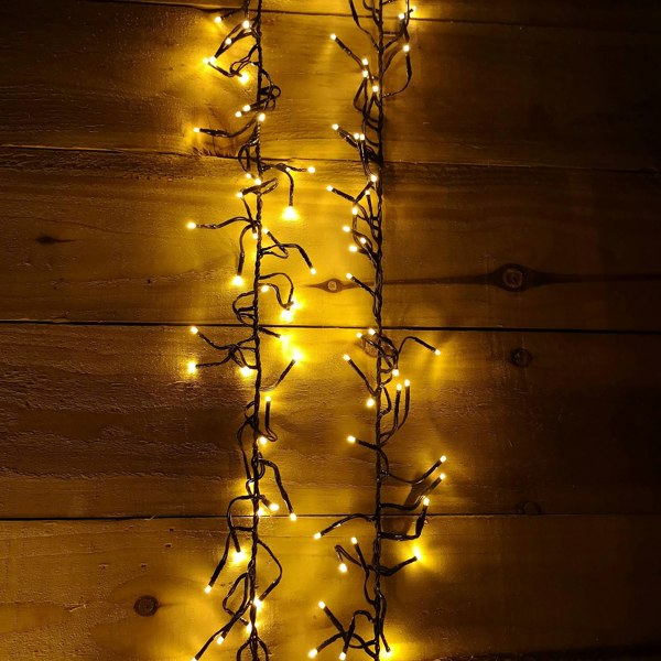 Samuel Alexander 960 LED 12m Premier Cluster Indoor Outdoor Multi Function Mains Operated Christmas Lights with Timer on Clear Cable in Warm White