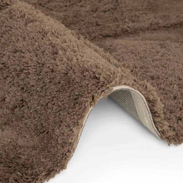 Brown textured rug on a white background