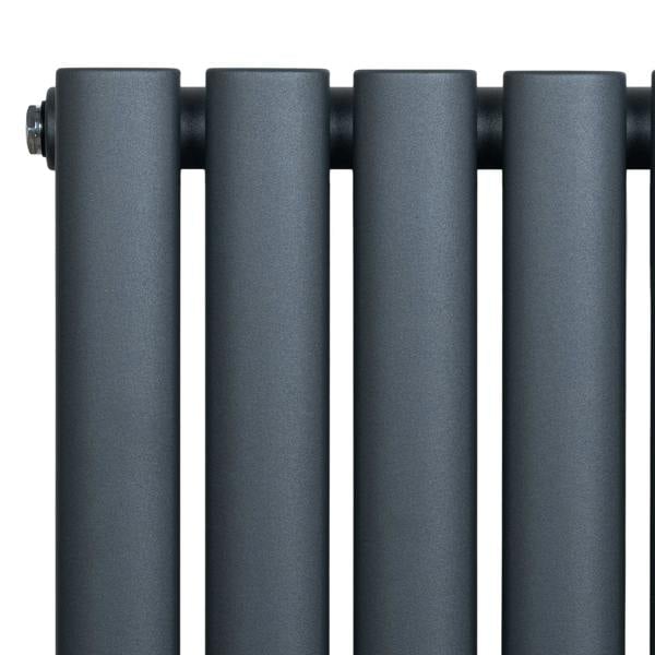 Oval single column radiator in anthracite grey, featuring a sleek, modern design with smooth, matte finish and rounded edges