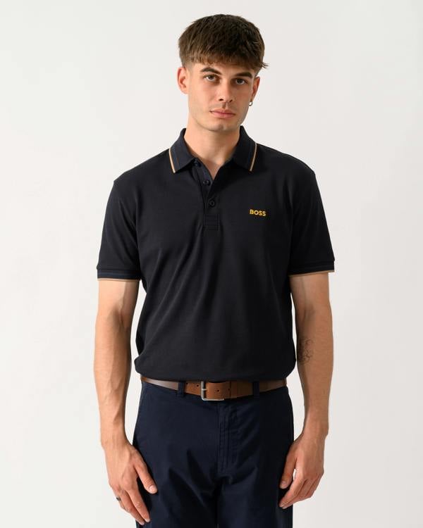 model wearing a BOSS Green Paddy Mens Cotton-Piqué Polo Shirt with Contrast Logo in Dark Blue 401
